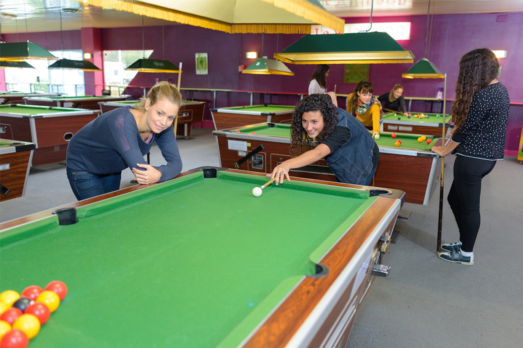 Ladies playing pool