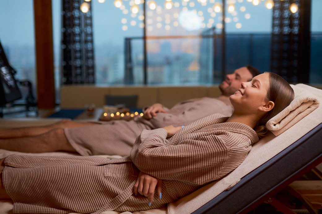 Lovely couple enjoying wellness spa resort treatments, Young caucasian husband and wide take pleasure, take rest together in spa center, relax and rest of whole body