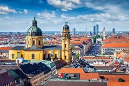 Wohnungssuche, Aerial view of Munich, Aerial view of Munich over Theatine Church of St. Cajetan (Theatinerkirche St. Kajetan) and Odeonplatz, Munich, Bavaria, Germany in day time